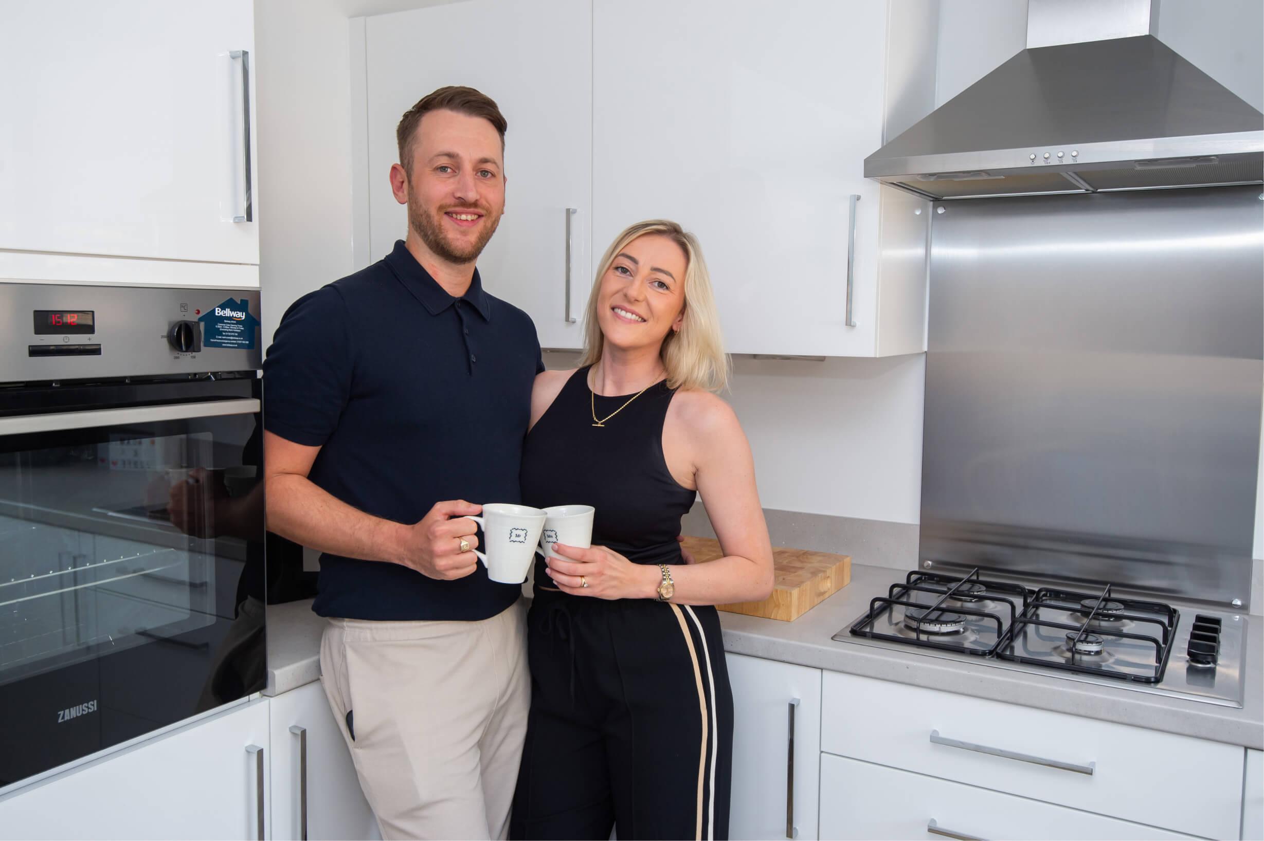 Jodie and Adam in their kitchen