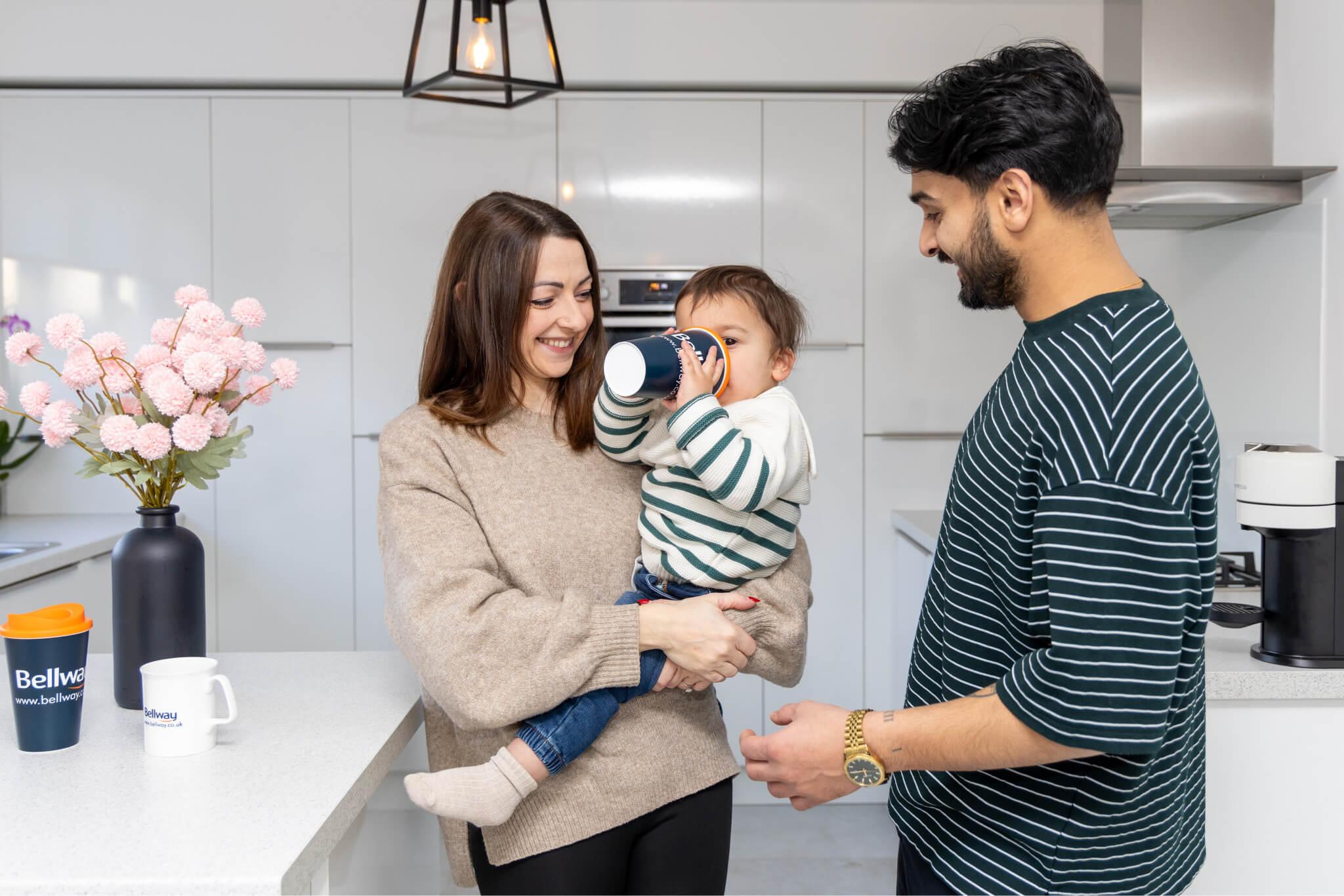 Lauren, Nitesh, and Luca in their home