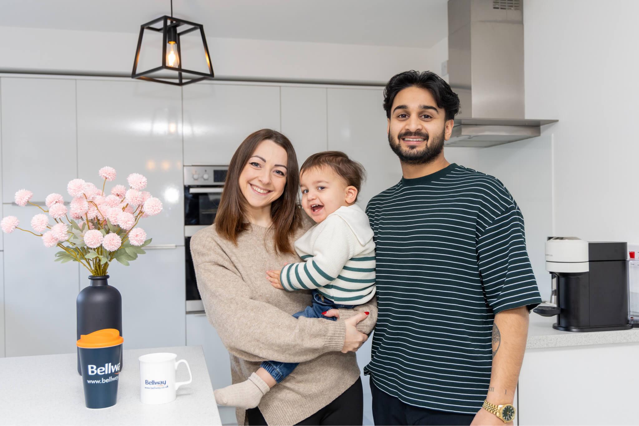 Lauren and Nitesh with son, Luca, in their new home