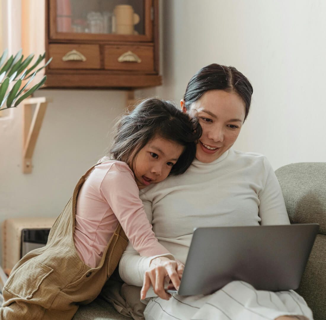 Mother and daughter with laptop