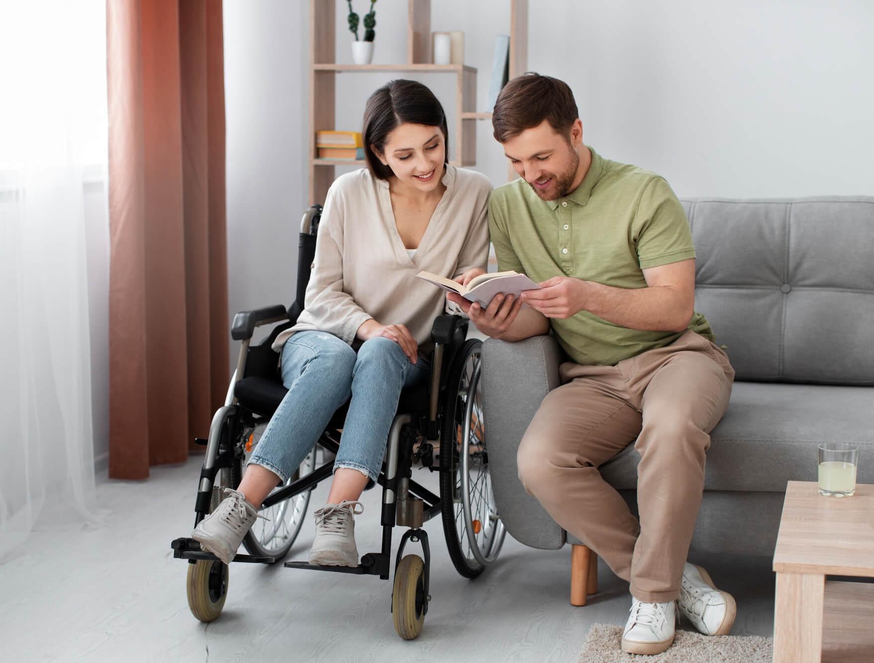 Female wheelchair user in home with man